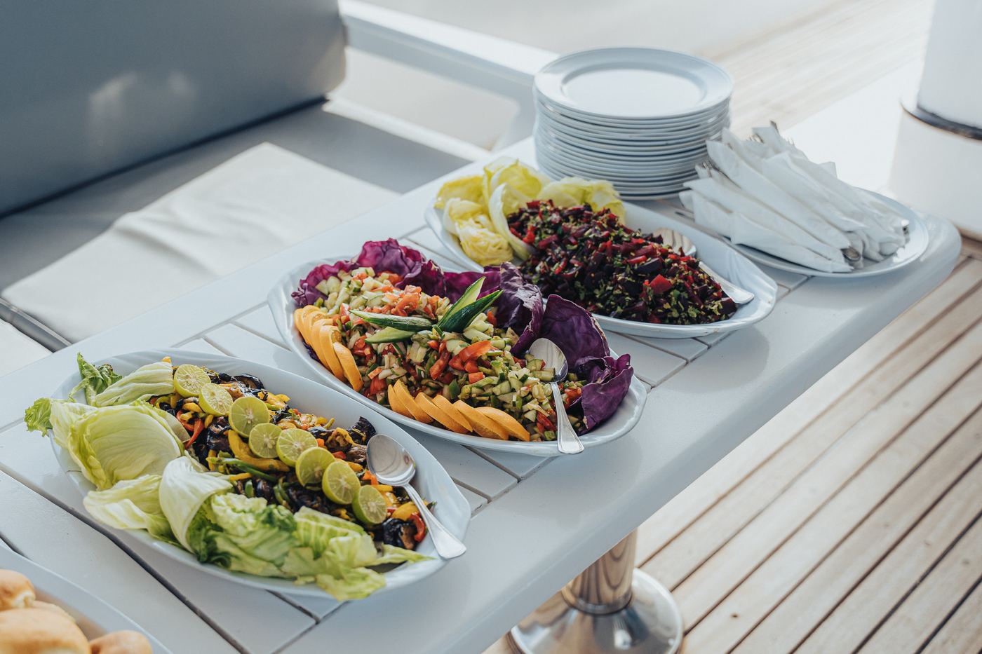 Fresh salads laid out on the buffet table