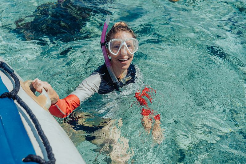 Laughter on the boat after a swim